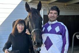Stawell trainer-driver Jason Ainsworth with his mother Katrina after 9yo trotting gelding Shadow Justice recorded his tenth career victory at Hamilton on Monday. Picture supplied by Hamilton HRC