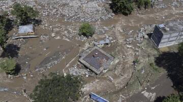 Flash flooding in West Sumatra, Indonesia, have killed at least 37 people. (AP PHOTO)