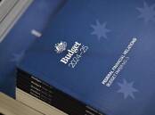 Treasury predictions in the budget show inflation dropping to 2.75 per cent by December. (Mick Tsikas/AAP PHOTOS)