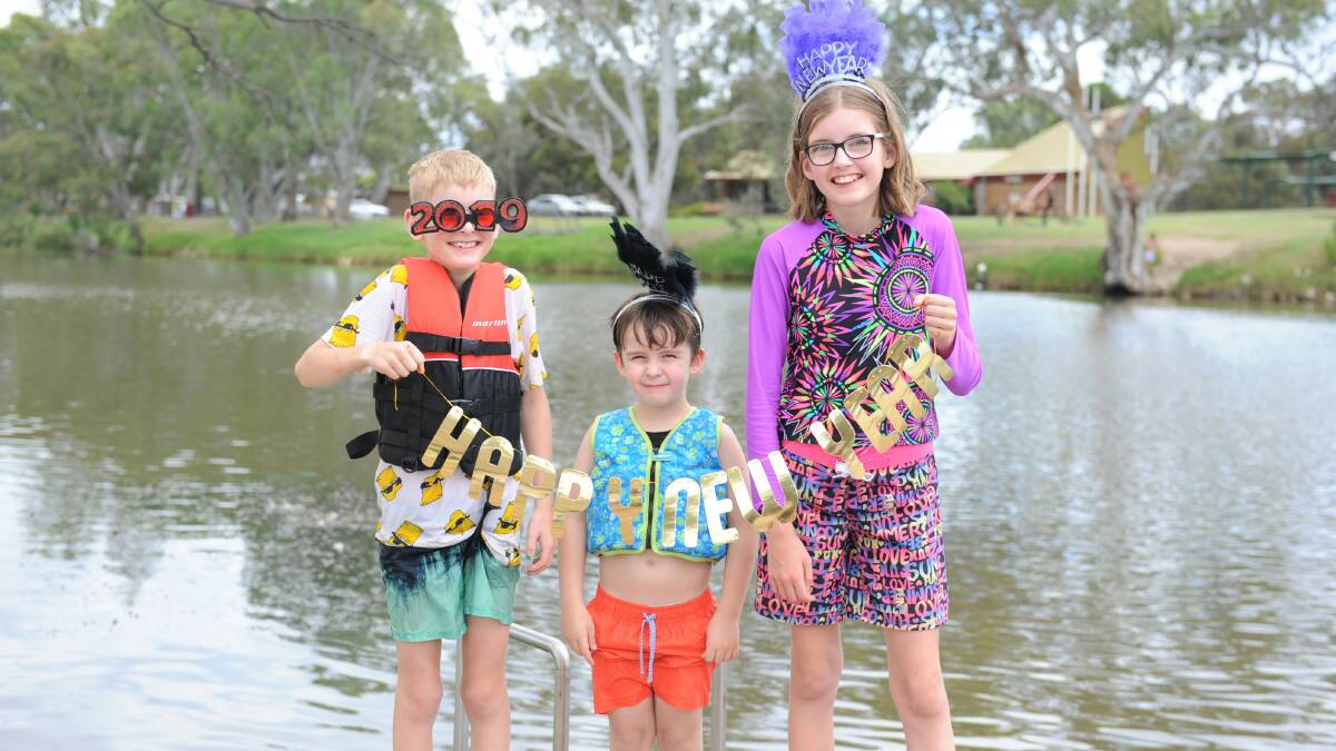 SAFE: Horsham residents Jude Millar, Spencer Southcott and Kalina Millar by Wimmera River in 2019. Picture: FILE