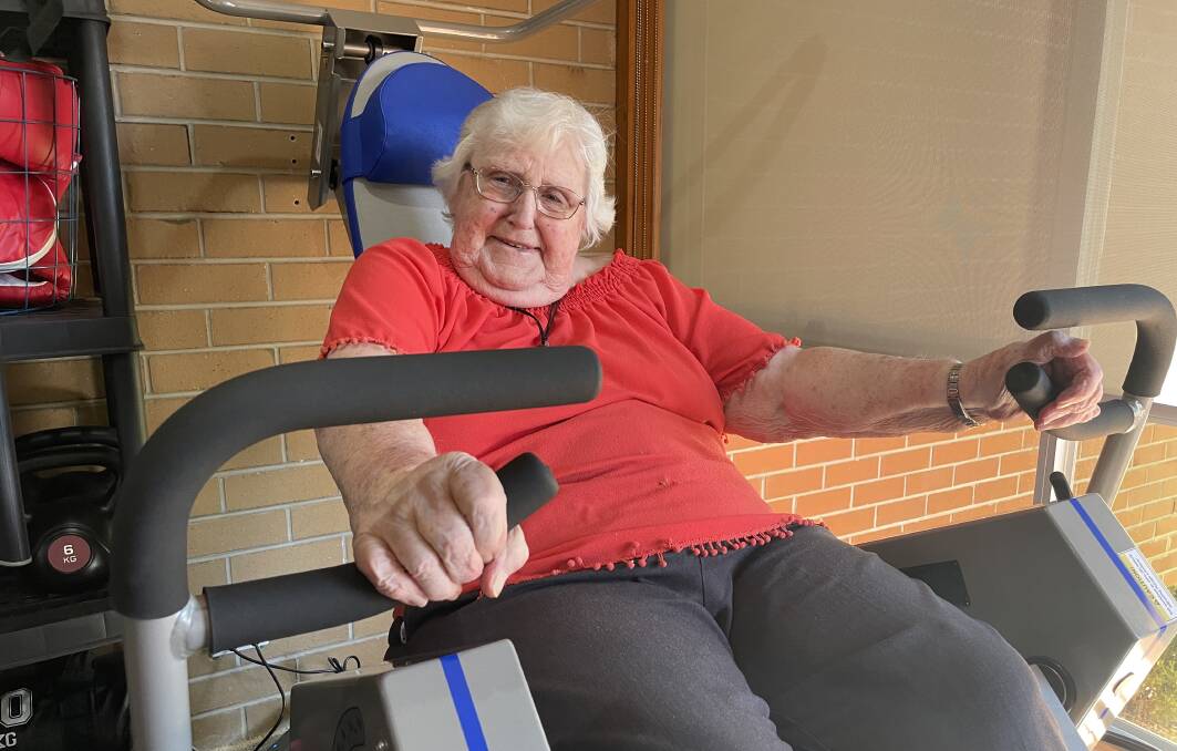 PUMPING IRON: Eventide Homes resident Beth Hodgetts uses one of the pneumatic exercise machines. Picture: ALEX DALZIEL