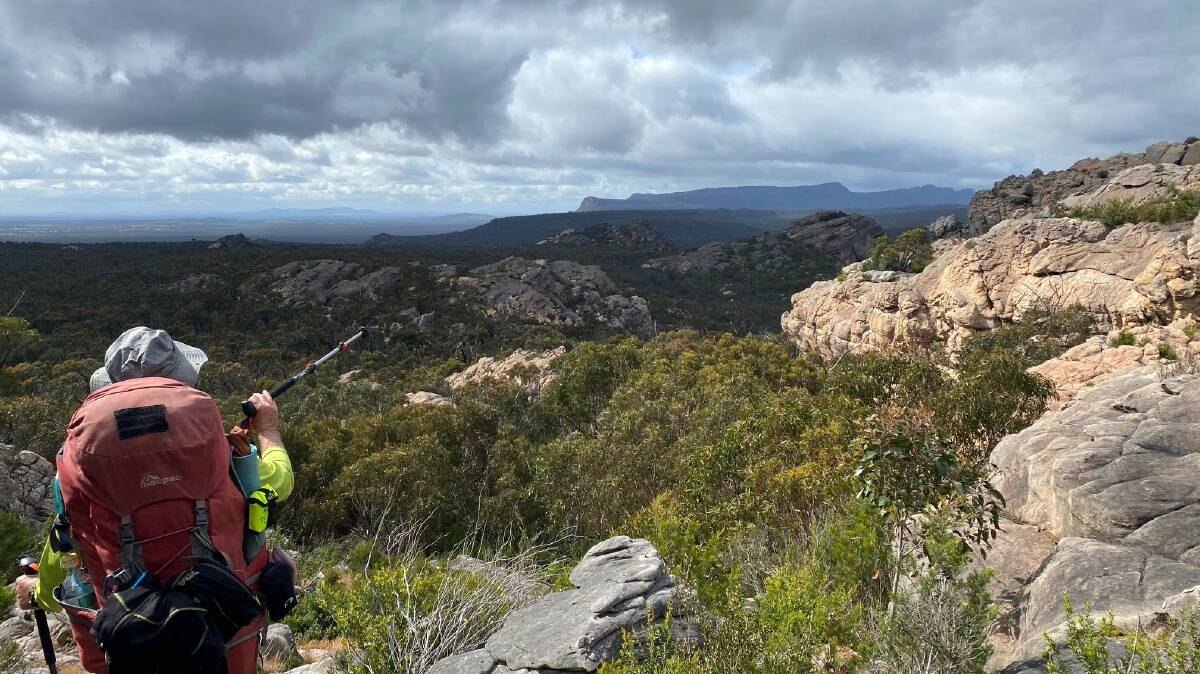 OVER THERE: Hermann Ritzinger points out something in the distance on the Grampians Peaks Trail. Picture: CONTRIBUTED
