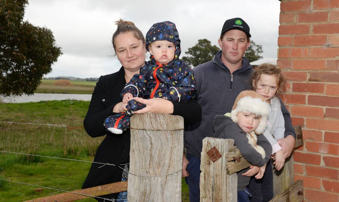 Fed up: Farmers Katherine and Ben Myers, with their children Angus, Tommy, and Charlotte, on their property in Tourello. Picture: Kate Healy