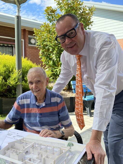 PLANS: Eventide Homes' chief executive Gary Simpson looking over new residential facility plans with resident Rod Tonkin. Picture: CONTRIBUTED