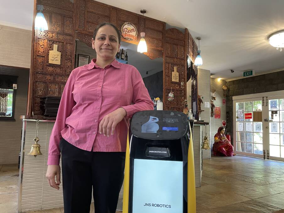 WORKING TOGETHER: Spirit of Punjab's Navjot Kaur is excited to show off the new robot to customers. Picture: CASSANDRA LANGLEY