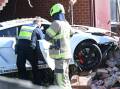 Emergency services check the crashed Lamborghini in Wendouree. Picture by Kate Healy